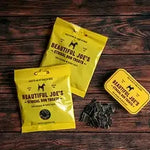 Beautiful Joe's ethical dog treats packaging with dried treats on wooden table